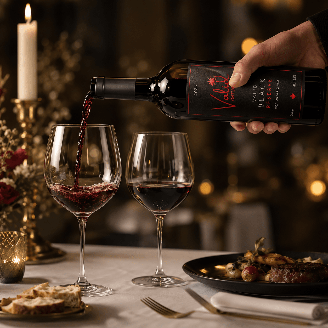 Red wine pouring from a bottle into a glass at an elegant candlelit dinner table.